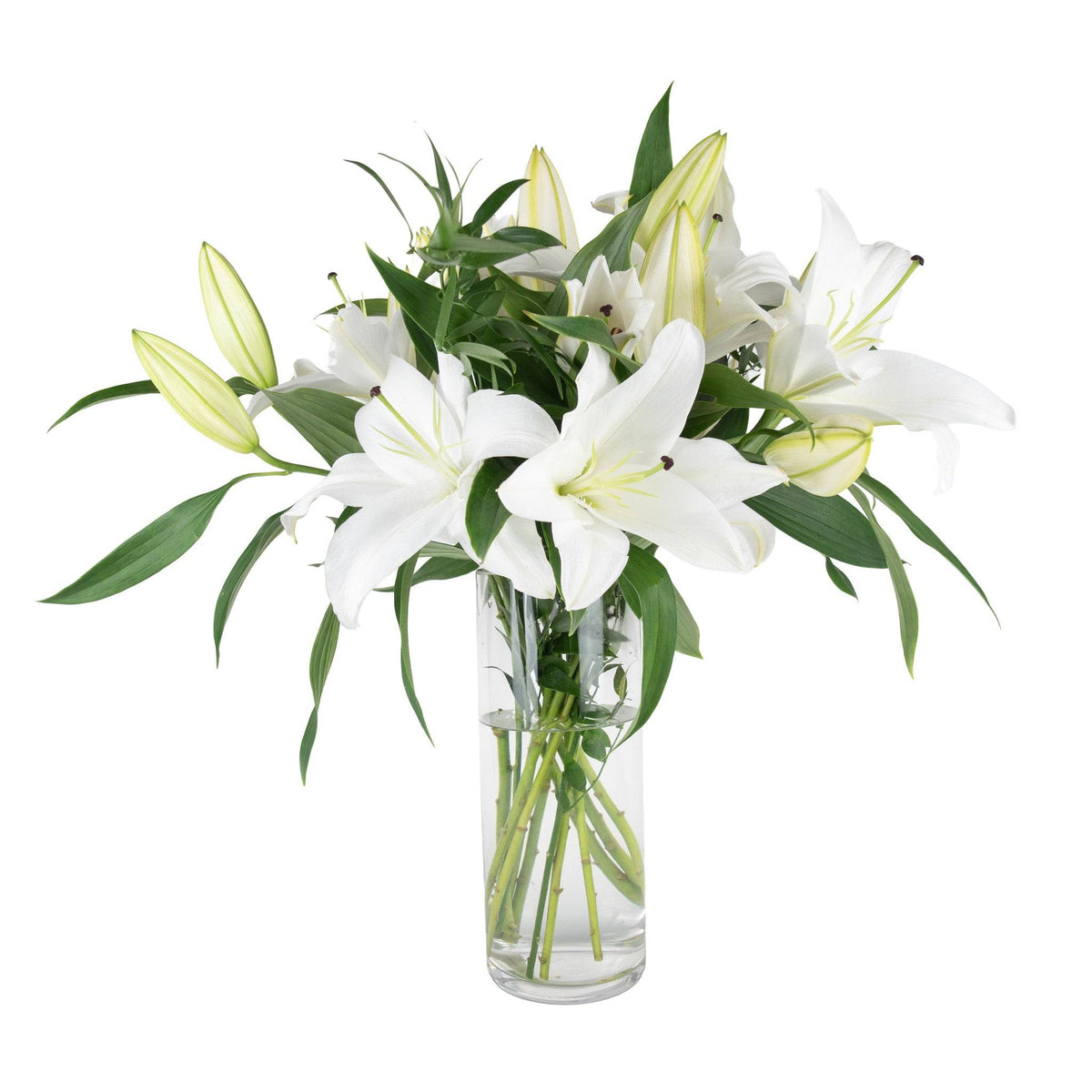 Elegant bouquet of white lilies with green leaves in a clear glass vase, fresh and fragrant for special occasions